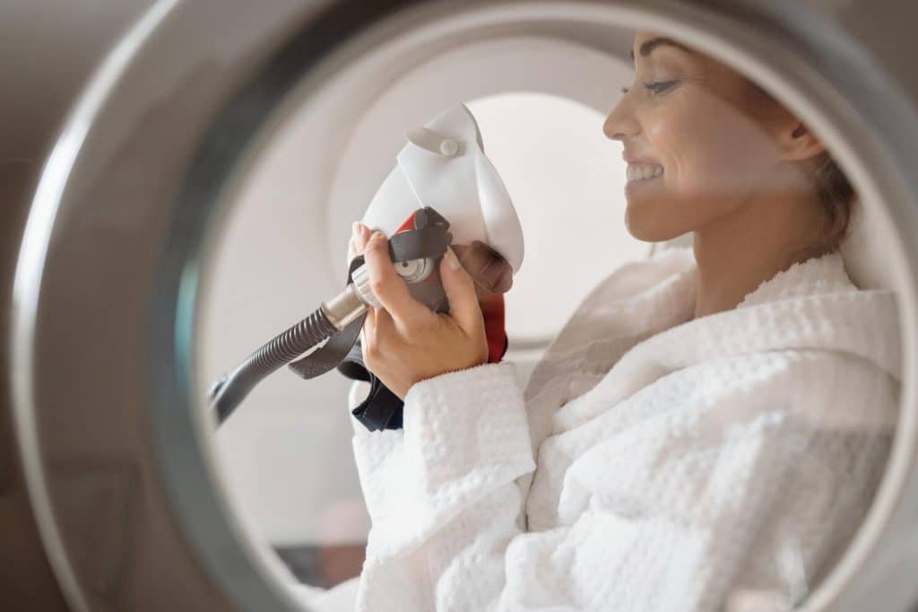 woman smiling hyperbaric oxygen therapy image