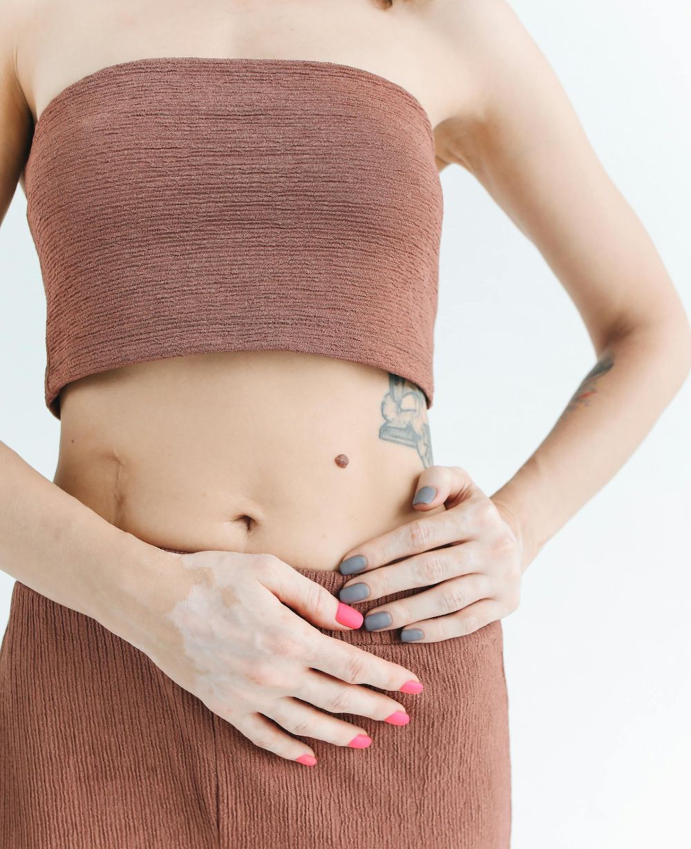 woman grabbing waist image